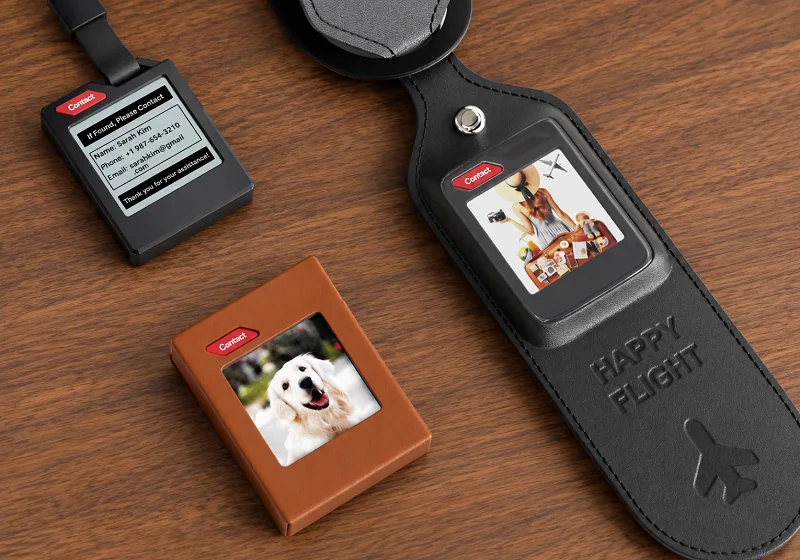 Several ePaper item tracking tags arranged on a wooden surface