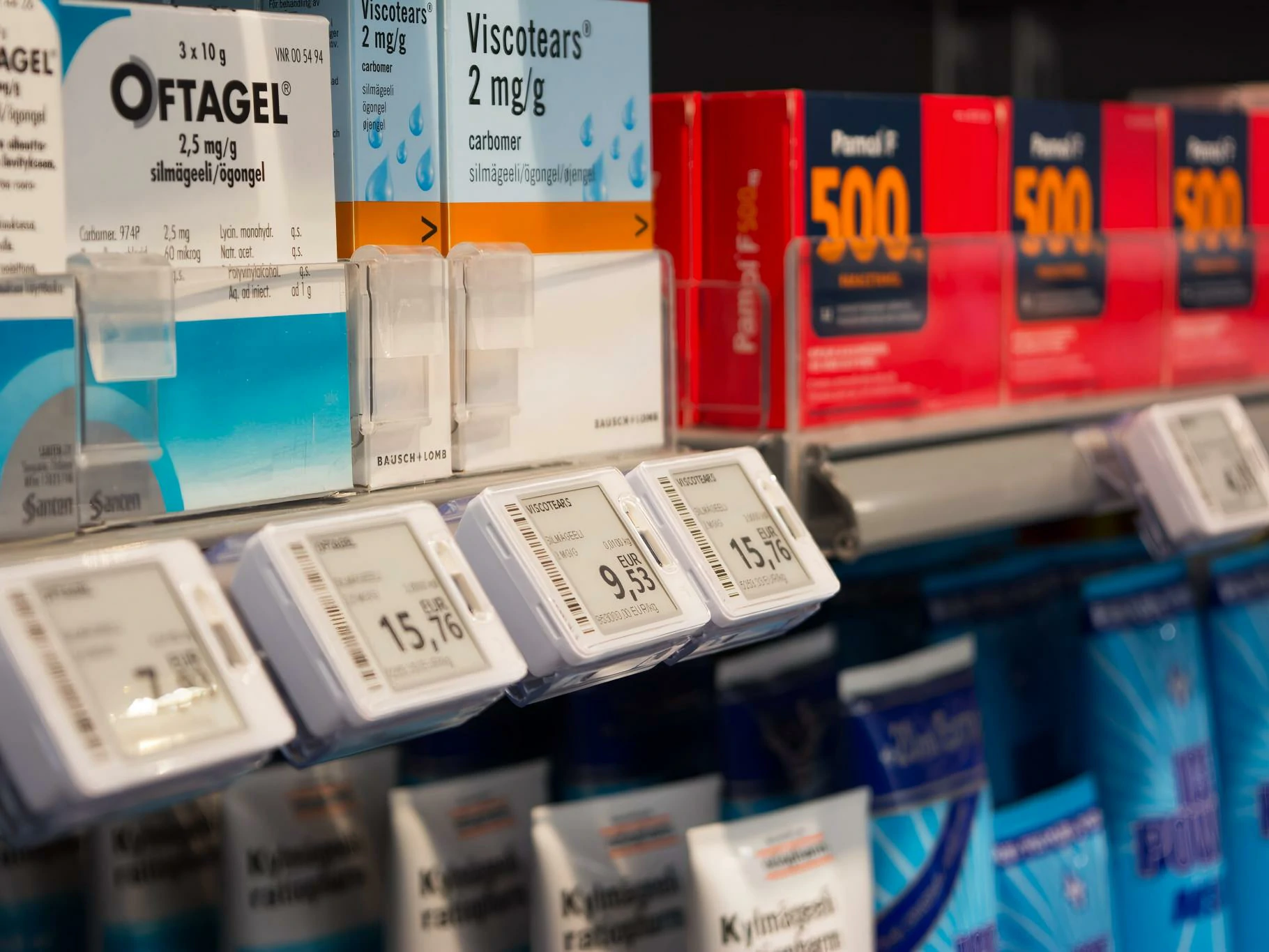 Retail shelf with electronic price labels beside packaged products