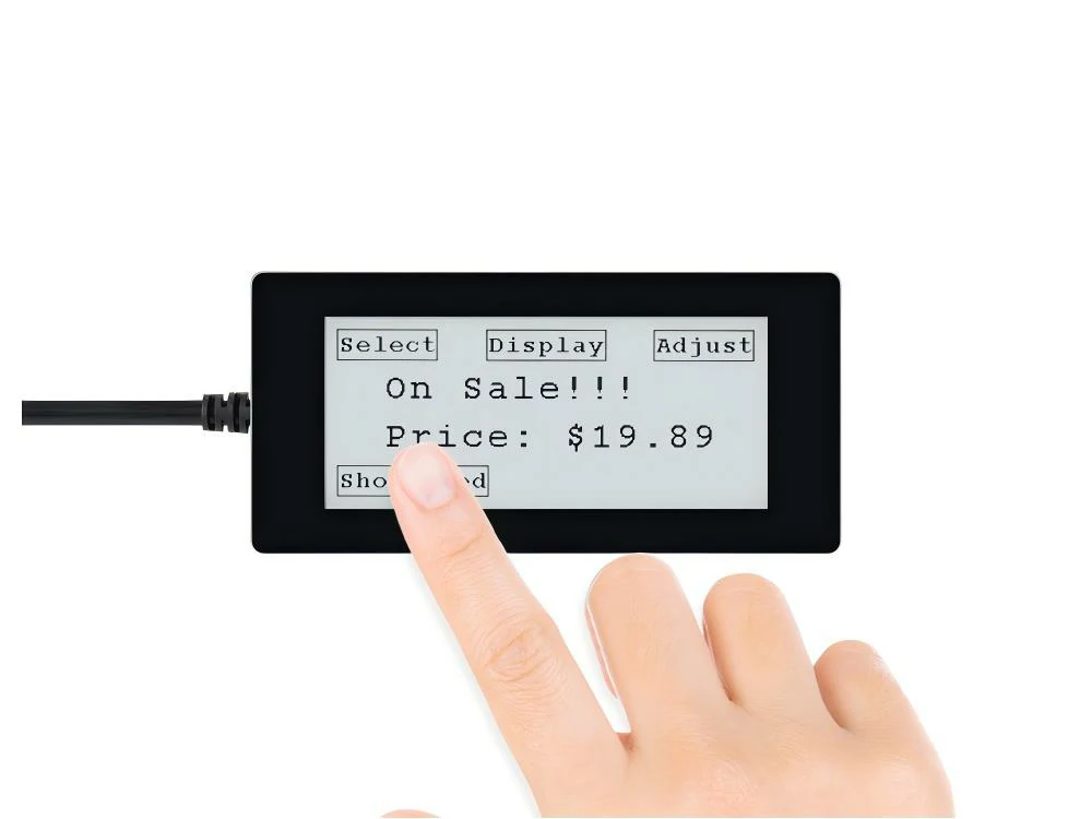 A finger touching an ePaper screen showing a price interface