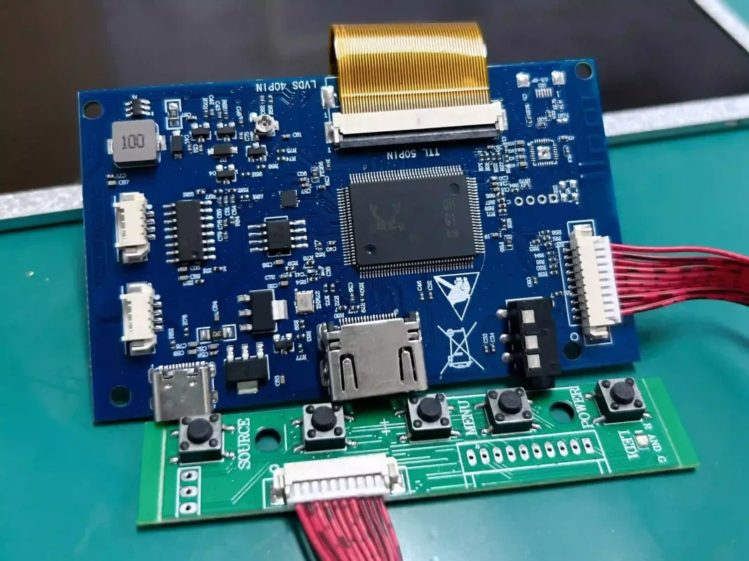 Blue LCD display controller board with a ribbon cable connector